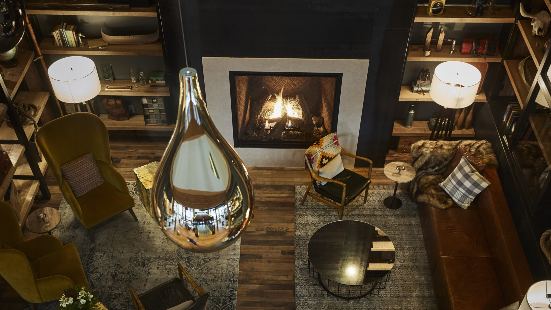 Aerial view of a cozy lounge area with a fireplace at our hotel in MPLS
