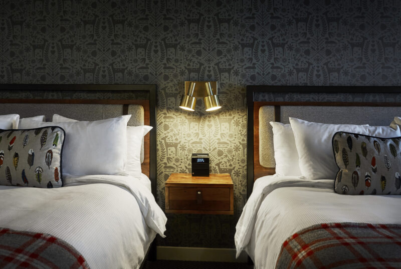 Nightstand between two beds at our boutique hotel in Minneapolis, MN