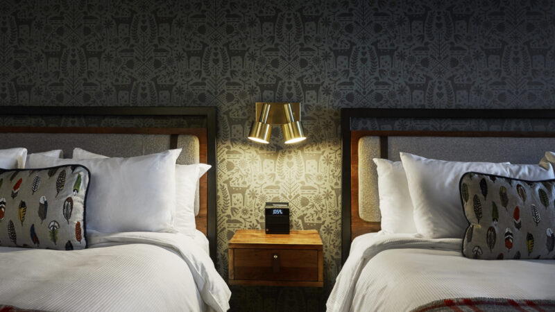 Nightstand between two beds at our boutique hotel in Minneapolis, MN