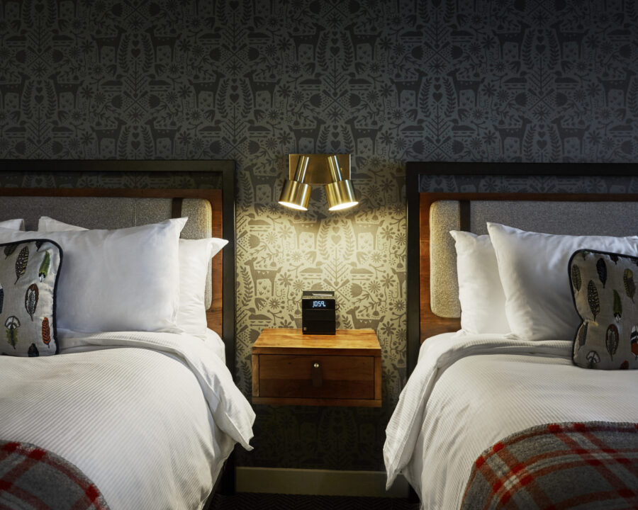Nightstand between two beds at our boutique hotel in Minneapolis, MN
