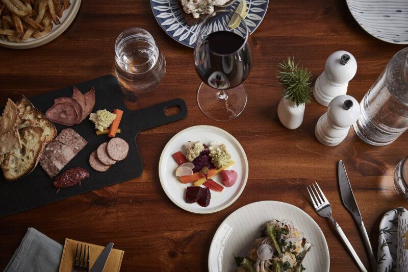 Various food dishes on a table at our boutique hotel in Minneapolis, MN