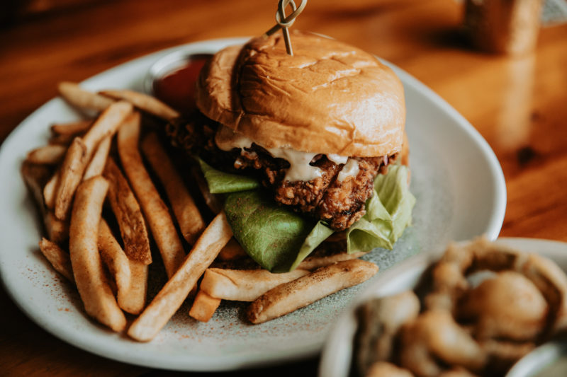 Crispy chicken sandwich and a side of fries at our boutique hotel in Minneapolis