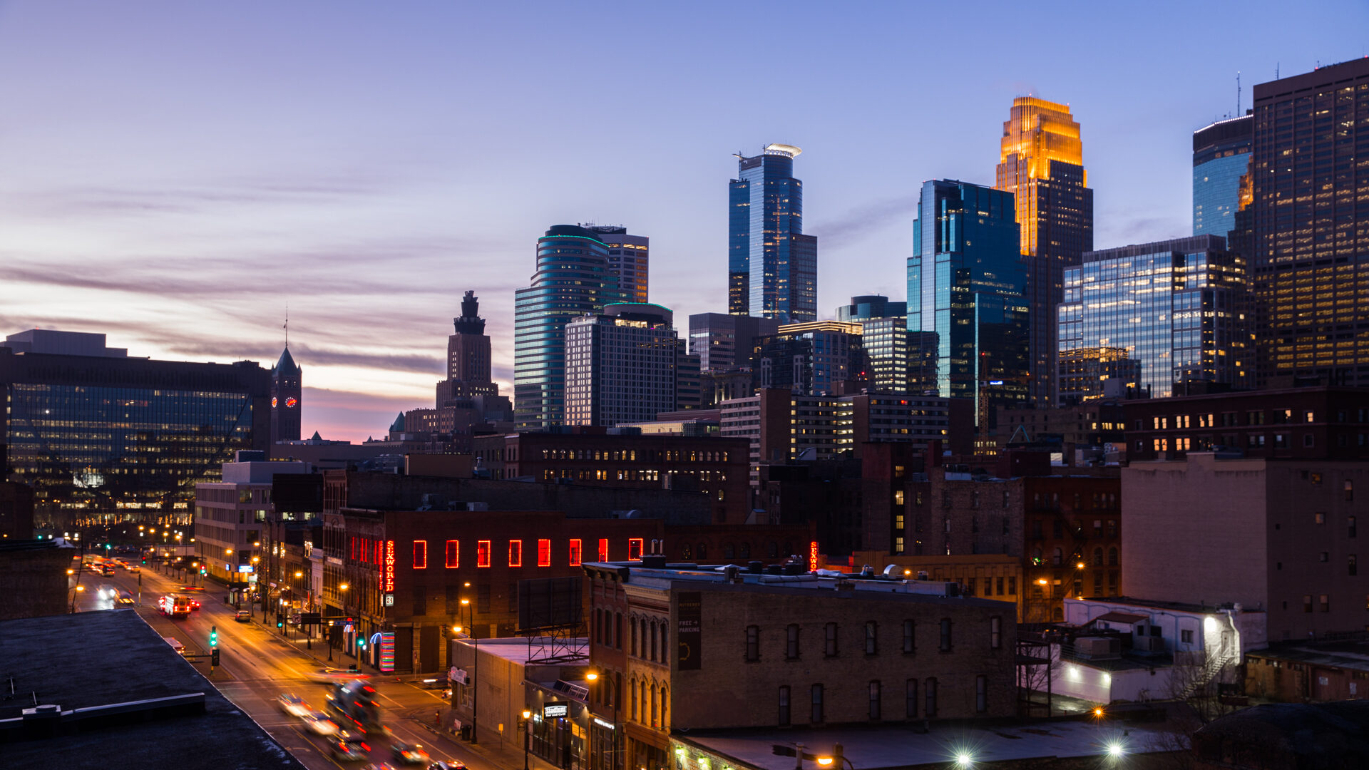 Sunset over the Minneapolis skyline, visible from the Hewing rooftop
