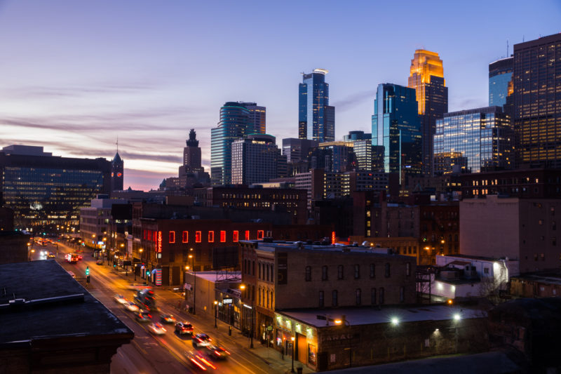 Sunset over the Minneapolis skyline, visible from the Hewing rooftop