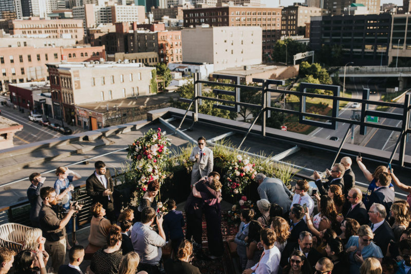 Crowd of people enjoying a wedding on our hotel's downtown Minneapolis rooftop