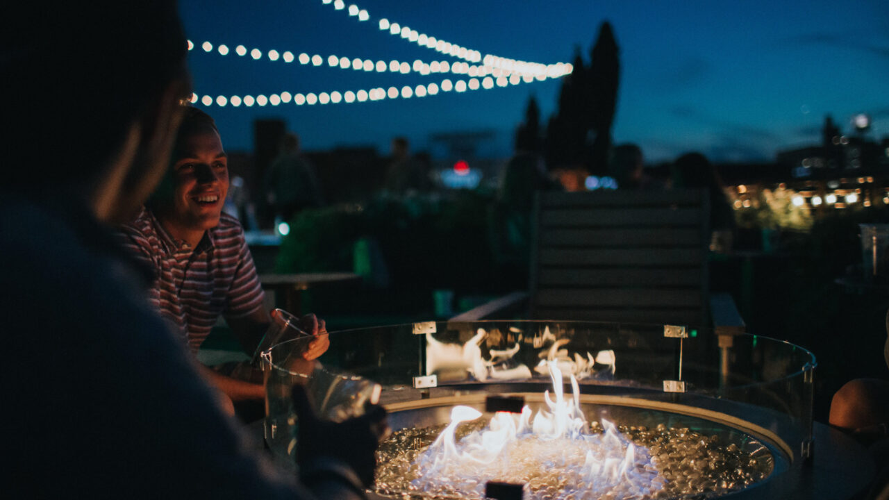 Friends gathered around a small fire at our downtown hotel in Minneapolis, MN