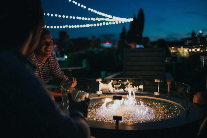 Friends gathered around a small fire at our downtown hotel in Minneapolis, MN