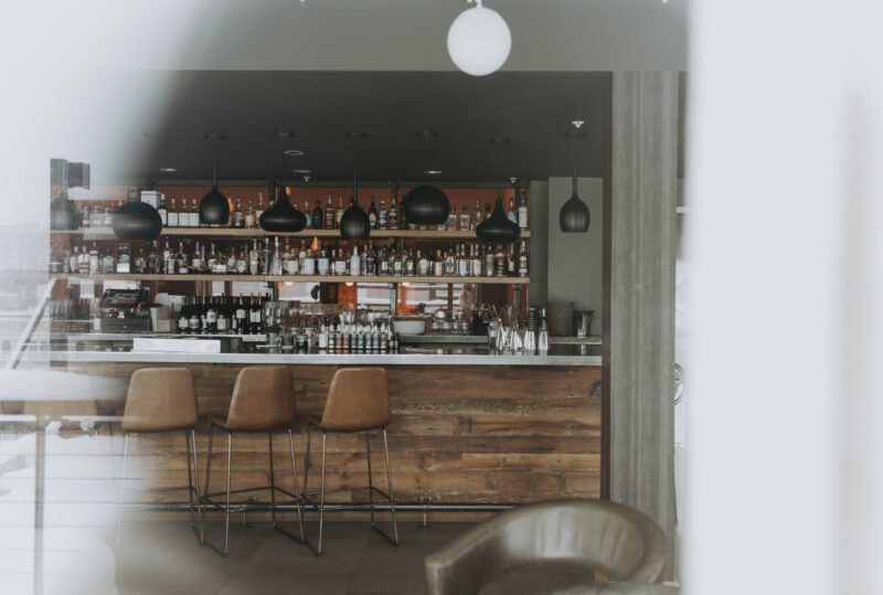 View of our downtown boutique hotel's Minneapolis bar through a window