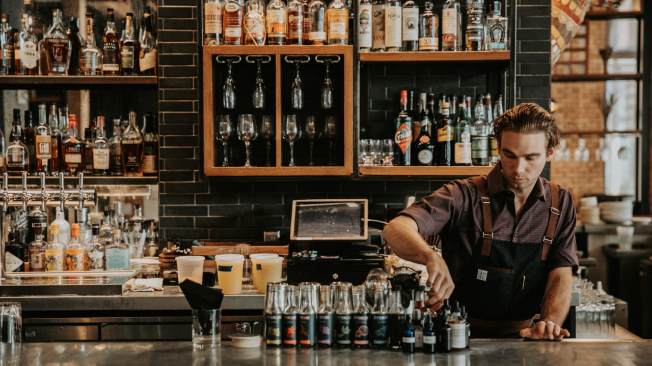 Bartender arranging bottles at our hotel in Minneapolis' downtown